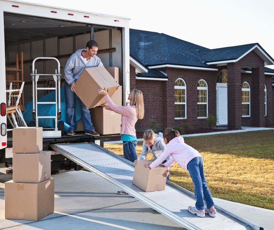 family loading moving truck